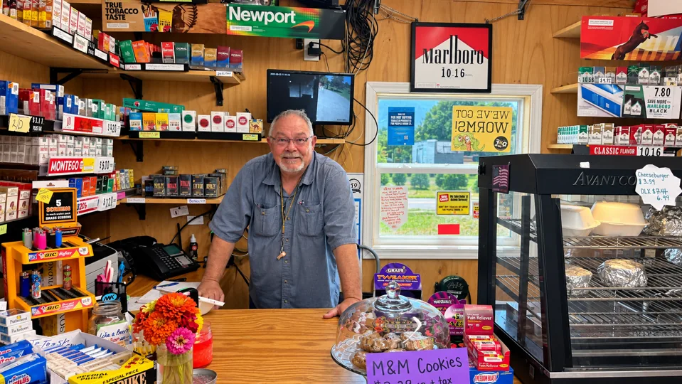 Larry behind the counter